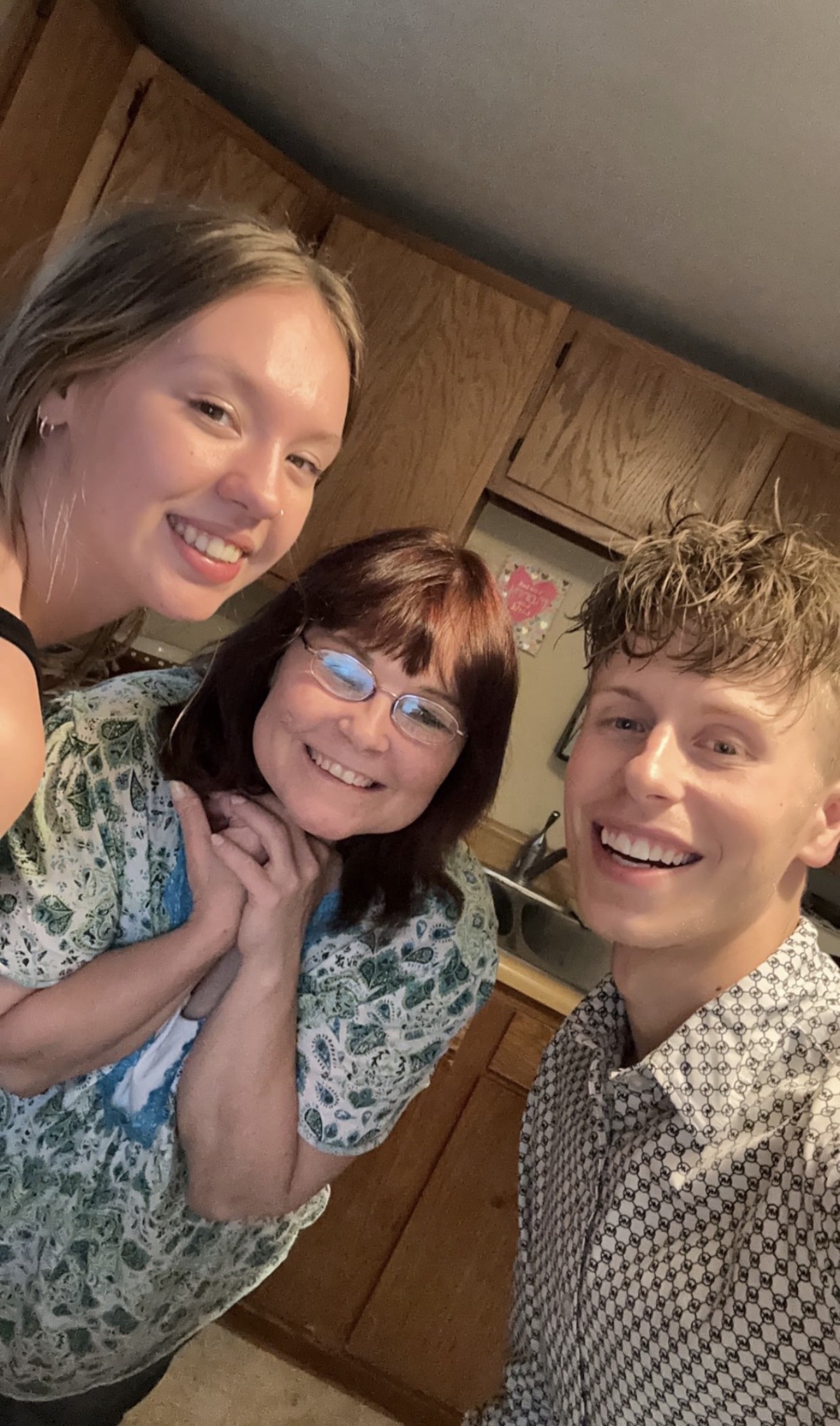 Kitchen selfie of Logen with his mom and Chelsey