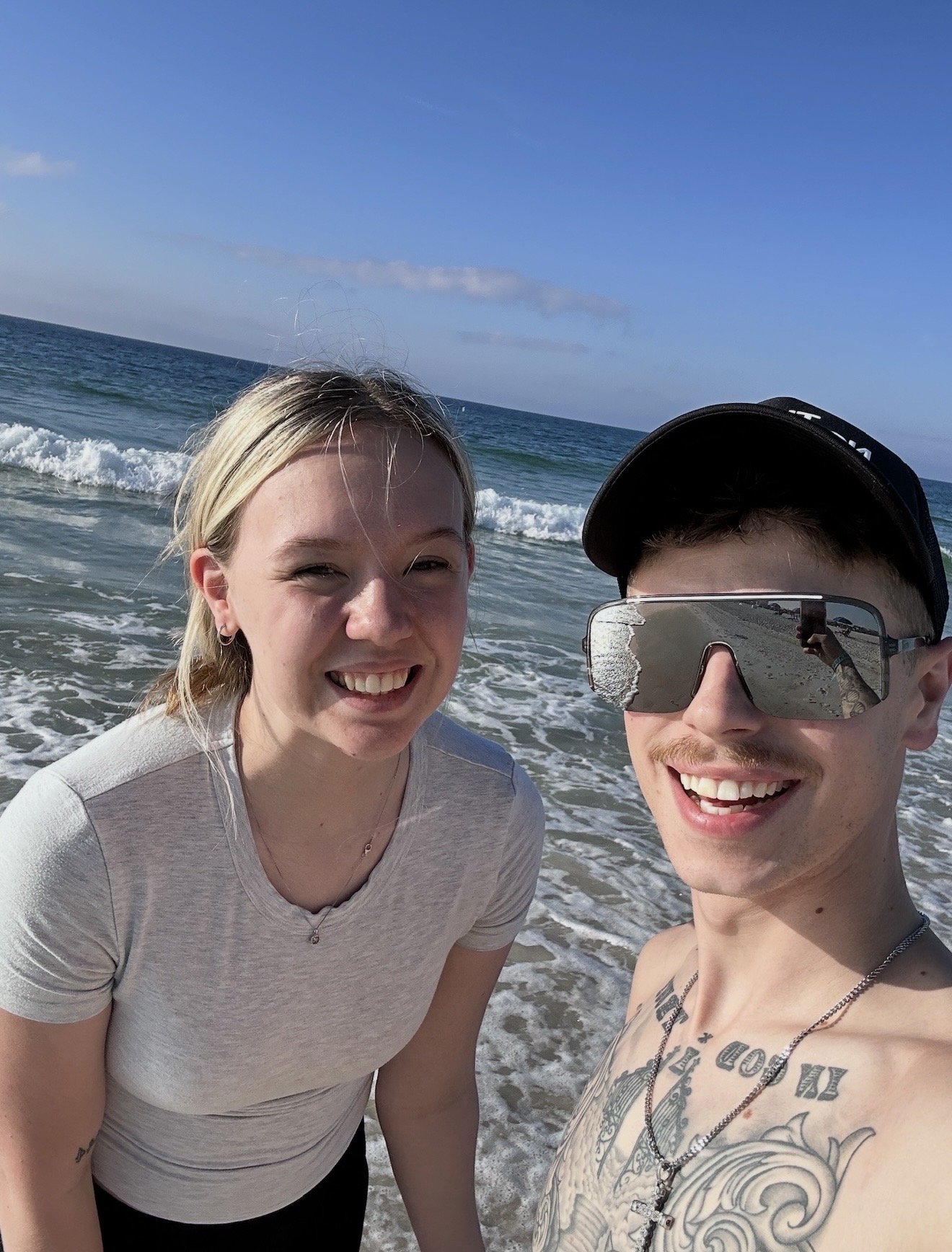 Beach selfie of Logen and Chelsey at the ocean